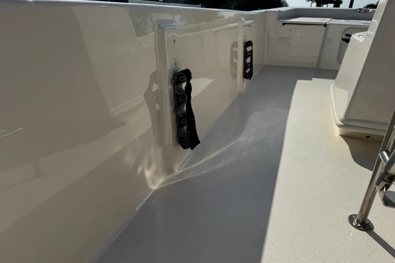 Slide: The Image of 2023 Carolina Skiff 21 SWS boat deck with storage compartments and sleek design. - 57