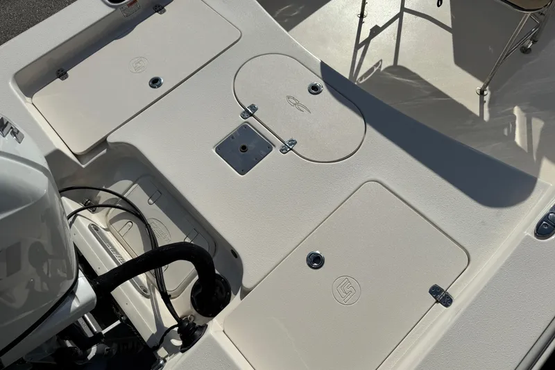 Slide: The Image of 2023 Carolina Skiff 21 SWS boat interior, showcasing sleek design and spacious deck. - 59