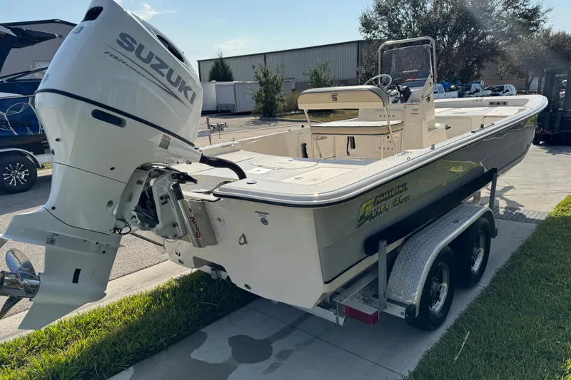 Slide: The Image of 2023 Carolina Skiff 21 SWS boat logo on white surface. - 6