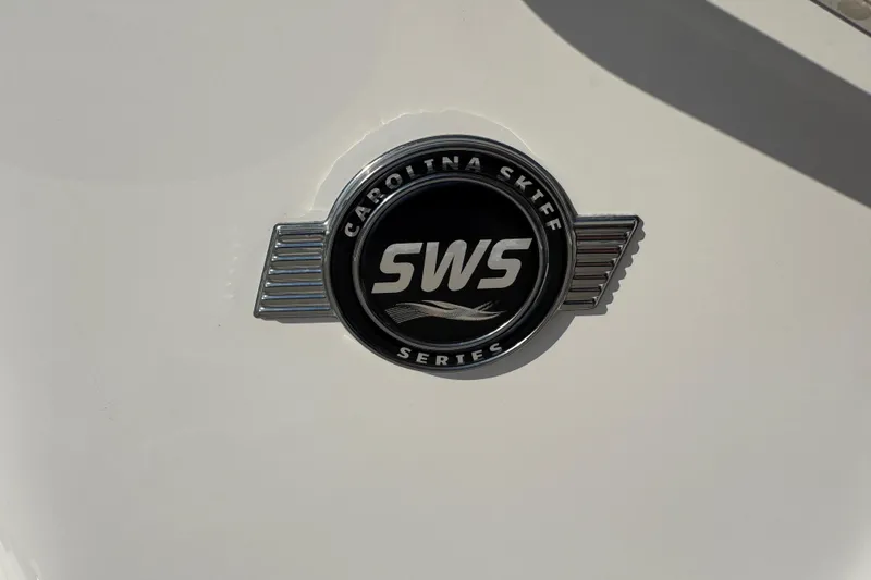 Slide: The Image of 2023 Carolina Skiff 21 SWS boat deck with storage compartments and fixtures. - 60