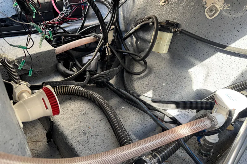 Slide: The Image of 2023 Carolina Skiff 21 SWS boat seat with diamond-patterned upholstery and logo. - 65