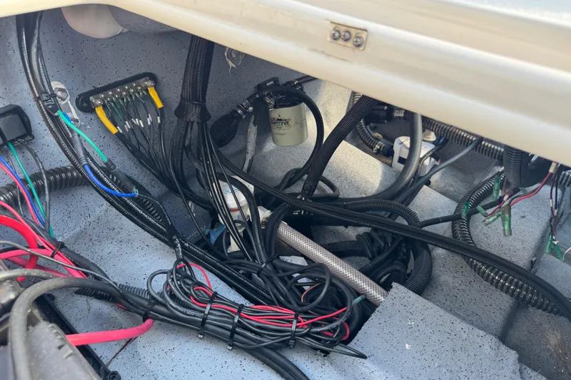 Slide: The Image of 2023 Carolina Skiff 21 SWS boat storage compartment with open hatch. - 71