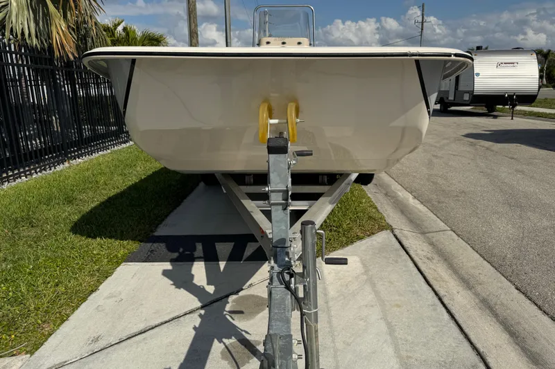 Slide: The Image of 2023 Carolina Skiff 21 SWS boat with Suzuki outboard motor on trailer. - 8