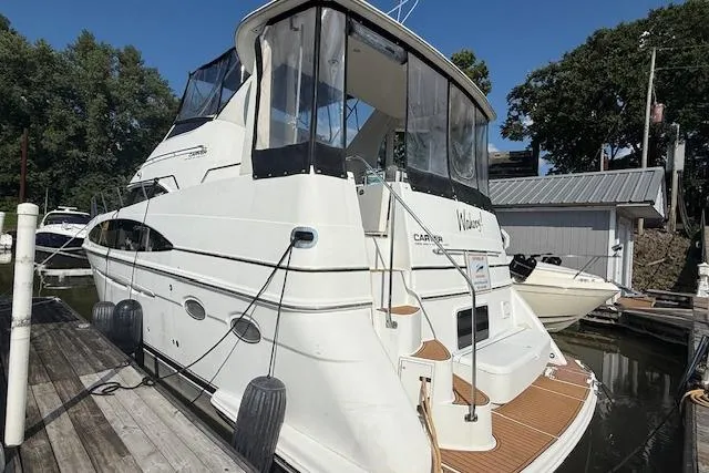 Slide: The Image of 2001 Carver 396 Aft Cabin Motor Yacht docked at marina, rear view. - 10