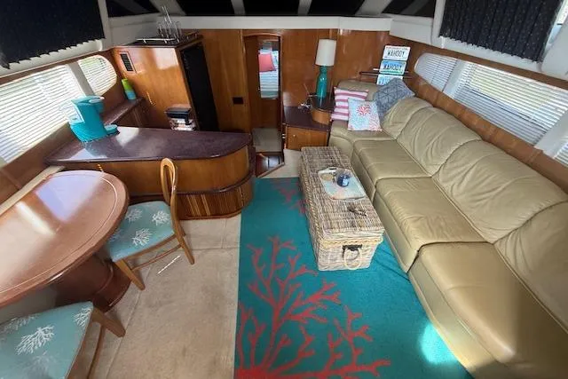 Slide: The Image of Interior of 2001 Carver 396 Aft Cabin Motor Yacht with cozy seating and dining area. - 6