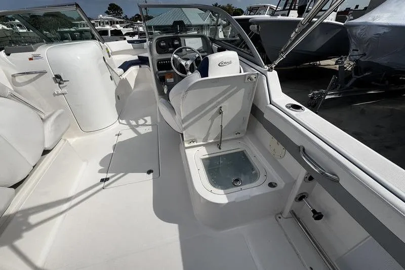 Slide: The Image of 2021 Robalo R227 Dual Console boat interior with seating and steering console. - 20