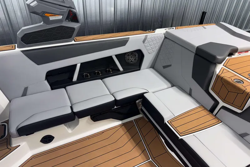 Slide: The Image of Luxurious interior of 2026 Nautique Super Air Nautique GS22 boat with modern seating design. - 10