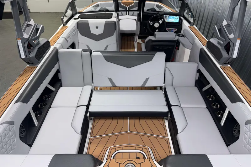 Slide: The Image of 2026 Nautique Super Air Nautique GS22 interior with luxurious seating and modern dashboard. - 13