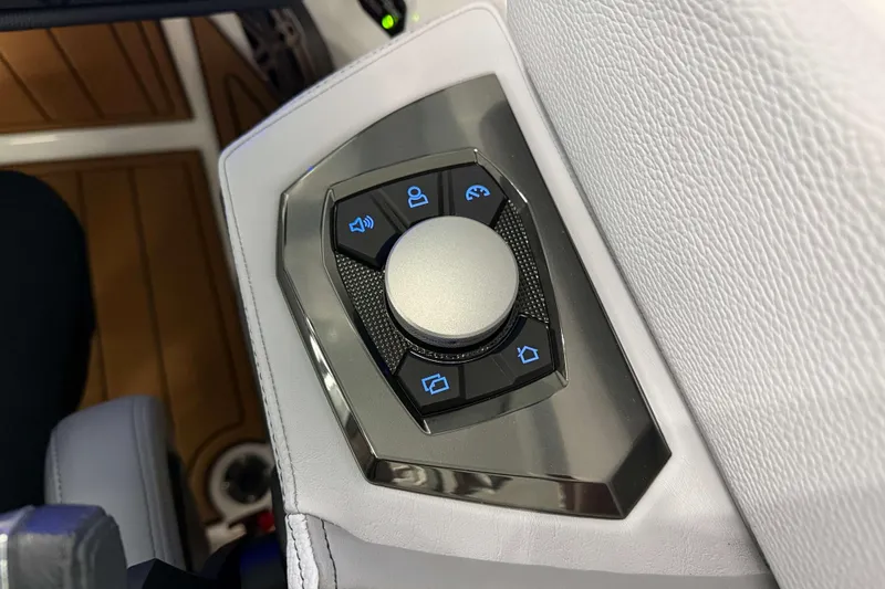Slide: The Image of Control panel of 2026 Nautique Super Air Nautique GS22 boat with various function buttons. - 22