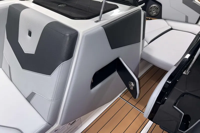 Slide: The Image of 2026 Nautique Super Air Nautique GS22 interior with sleek seating and storage compartment. - 23