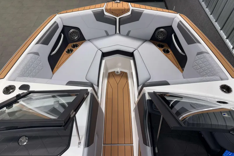 Slide: The Image of 2026 Nautique Super Air Nautique GS22 boat interior with luxurious seating and modern design. - 29