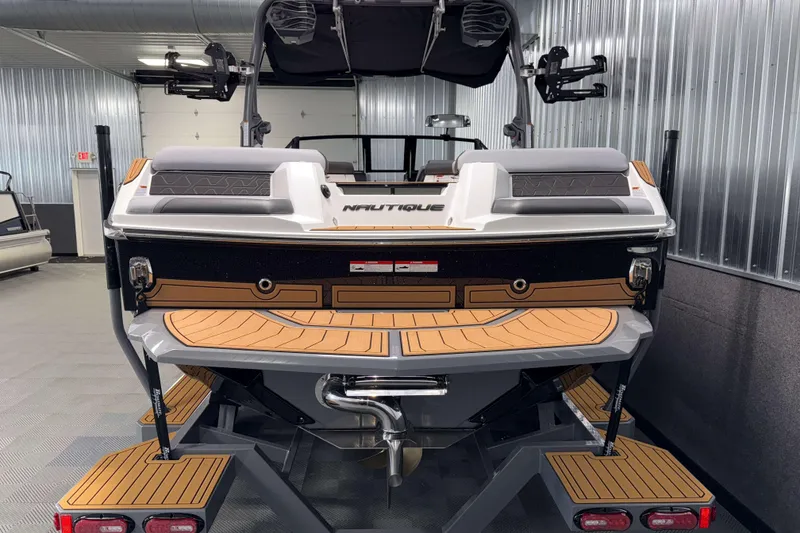 Slide: The Image of 2026 Nautique Super Air Nautique GS22 boat in showroom, rear view. - 39