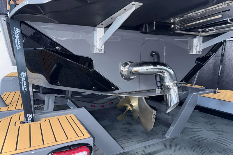 Slide: The Image of 2026 Nautique Super Air Nautique GS22 boat stern with propeller and exhaust system. - 41