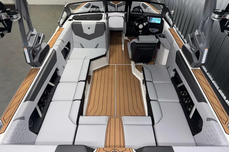 Slide: The Image of 2026 Nautique Super Air Nautique GS22 interior with sleek seating and modern dashboard. - 6