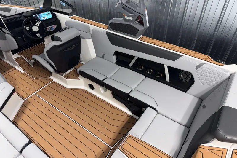 Slide: The Image of 2026 Nautique Super Air Nautique GS22 interior with sleek seating and modern dashboard. - 8