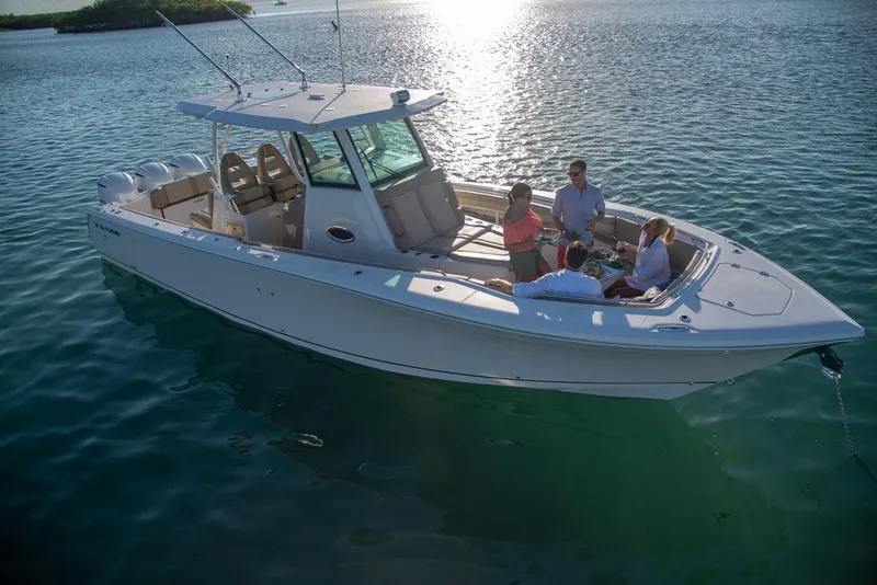 Slide: The Image of Sailfish 360 CC 2022 boat on calm water with passengers. - 10