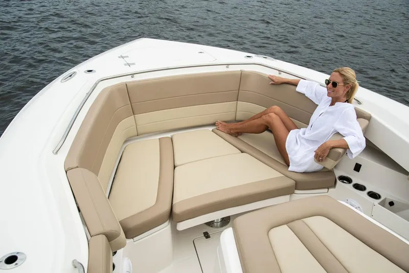 Slide: The Image of Woman relaxing on 2022 Sailfish 360 CC boat. - 13