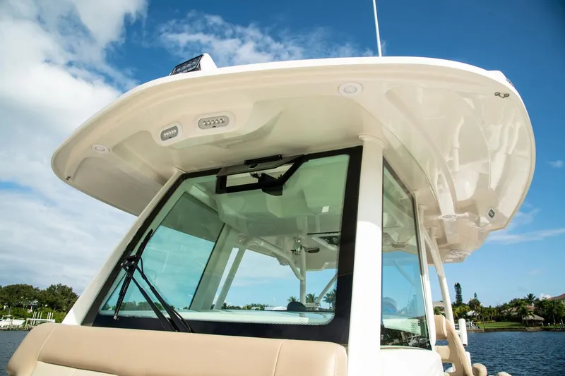 Slide: The Image of Sailfish 360 CC 2022 boat with modern design and blue sky background. - 23