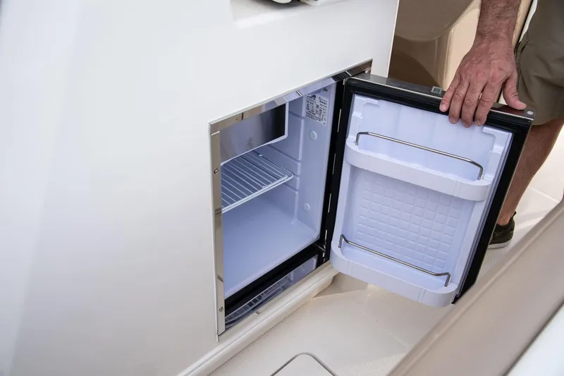 Slide: The Image of Open refrigerator on a 2022 Sailfish 360 CC boat. - 26