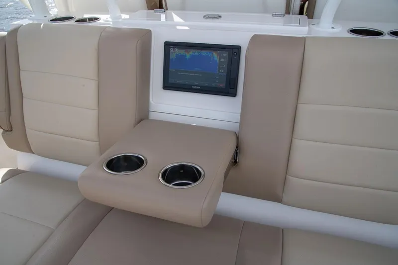 Slide: The Image of Sailfish 360 CC 2022 boat seat with cup holders and screen. - 27