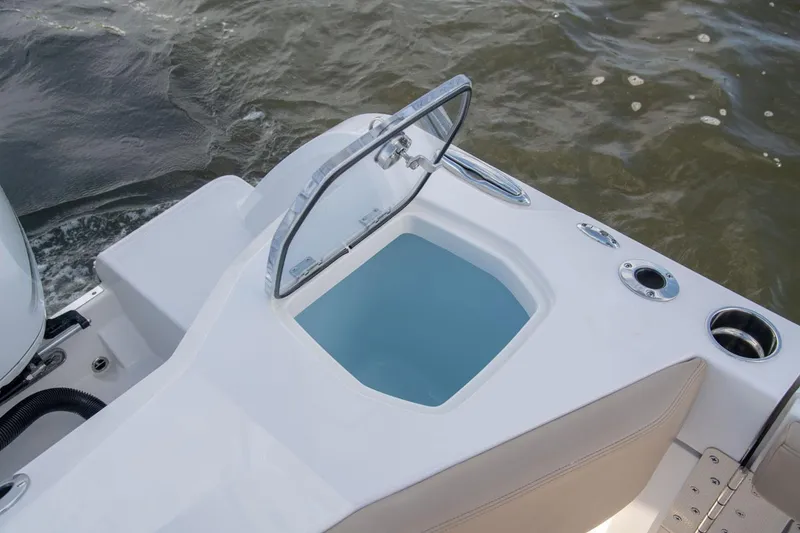 Slide: The Image of Sailfish 360 CC 2022 boat with open storage compartment on water. - 29