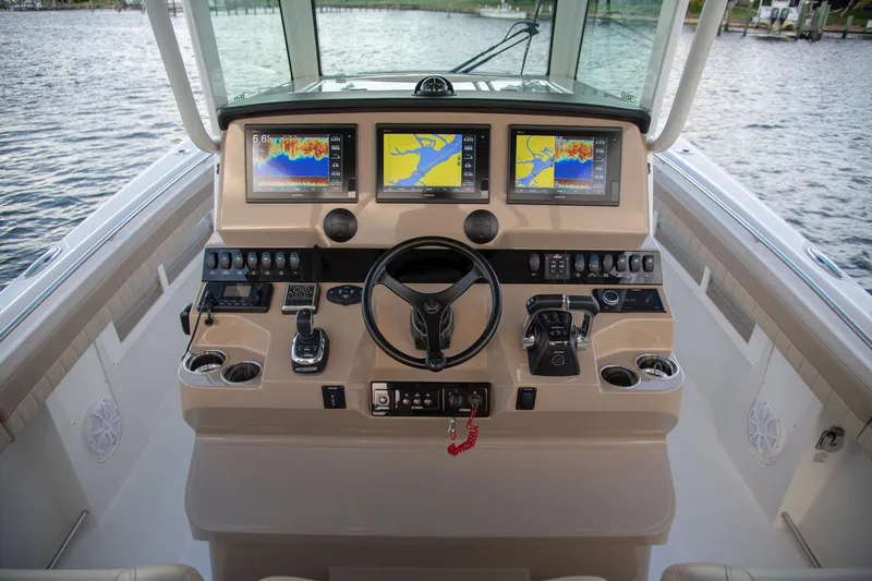 Slide: The Image of 2022 Sailfish 360 CC helm with advanced navigation systems. - 30