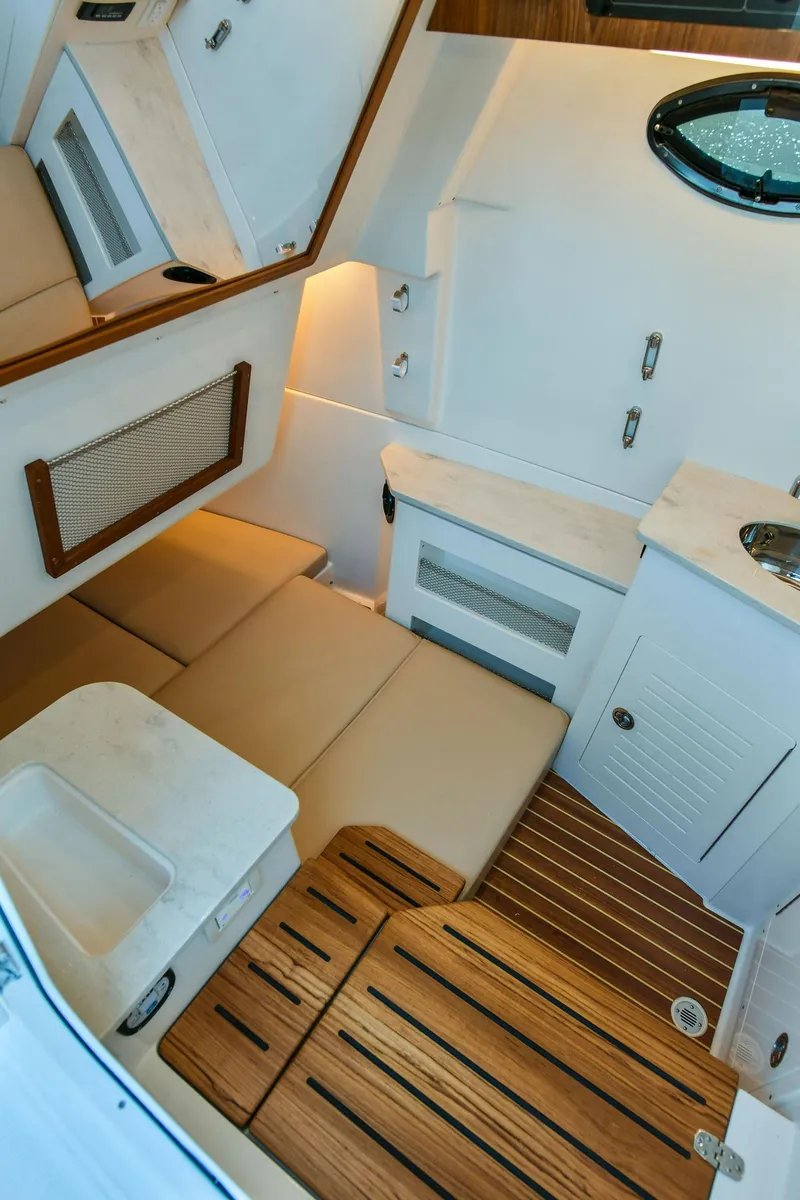 Slide: The Image of 2022 Sailfish 360 CC cabin interior with wood flooring. - 31