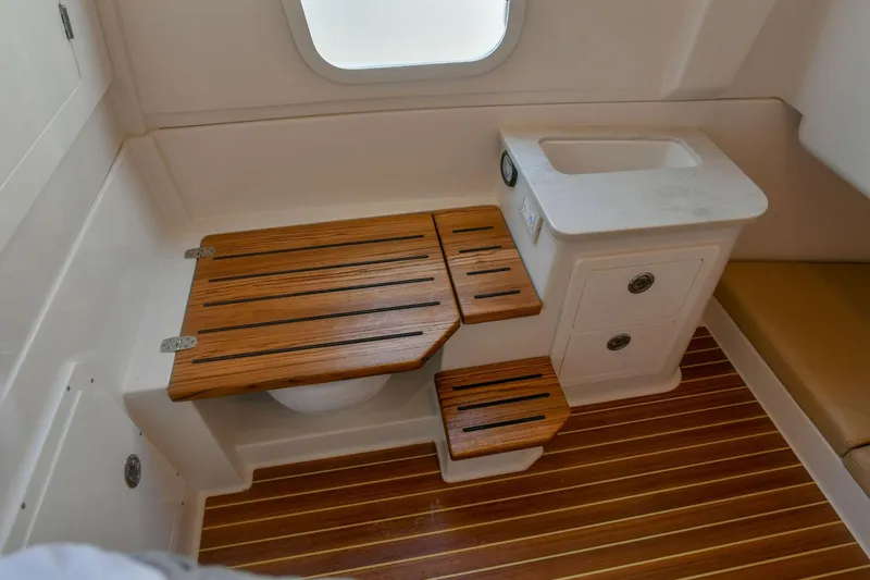 Slide: The Image of Interior of 2022 Sailfish 360 CC with wooden accents. - 34