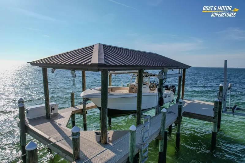 Slide: The Image of 2018 Key West Billistic 351 Center Console on docked lift over ocean. - 10