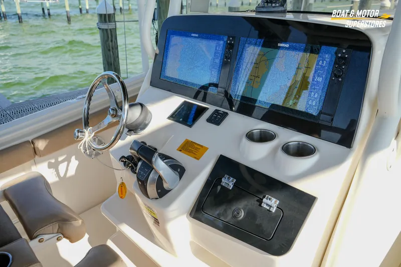 Slide: The Image of 2018 Key West Billistic 351 Center Console helm with dual Simrad displays and controls. - 102