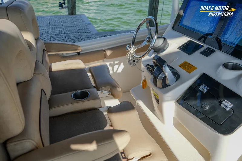 Slide: The Image of 2018 Key West Billistic 351 Center Console interior with helm and seating. - 103