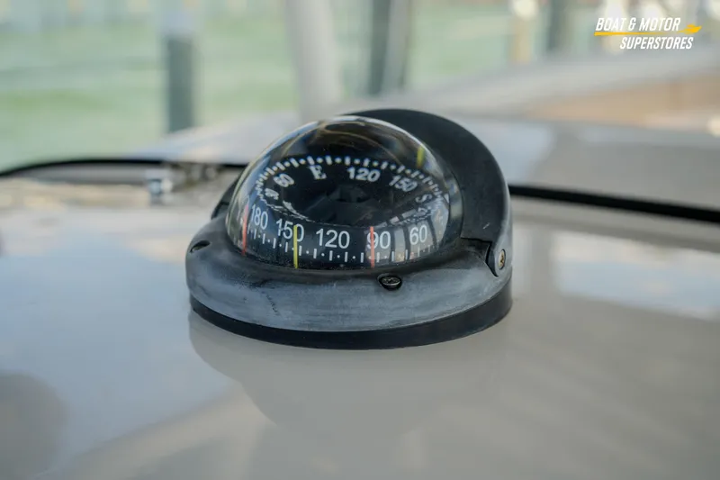 Slide: The Image of Compass on 2018 Key West Billistic 351 Center Console boat dashboard. - 109