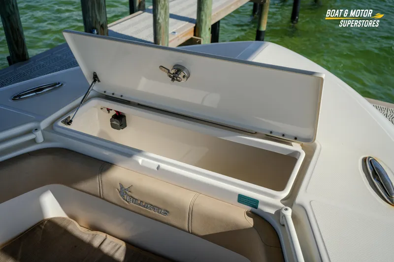 Slide: The Image of 2018 Key West Billistic 351 Center Console boat storage compartment open at dock. - 115