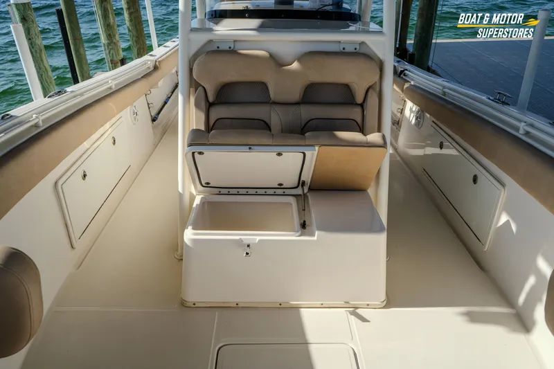 Slide: The Image of 2018 Key West Billistic 351 Center Console interior with seating and storage compartments. - 121