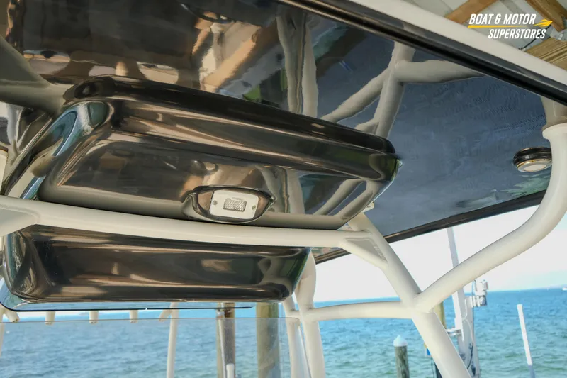 Slide: The Image of 2018 Key West Billistic 351 Center Console boat roof detail with ocean background. - 122