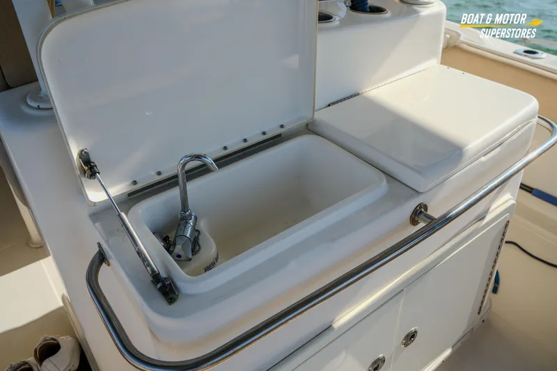 Slide: The Image of 2018 Key West Billistic 351 Center Console boat sink and storage area. - 131