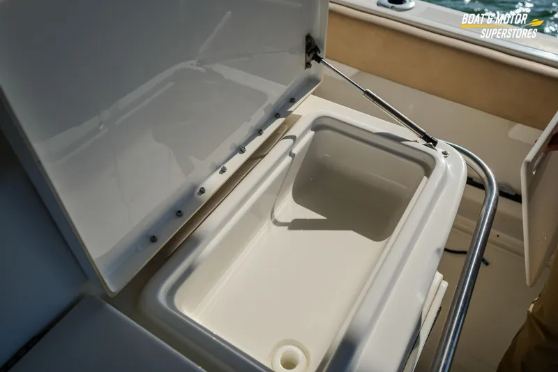 Slide: The Image of Open storage compartment on 2018 Key West Billistic 351 Center Console boat. - 136