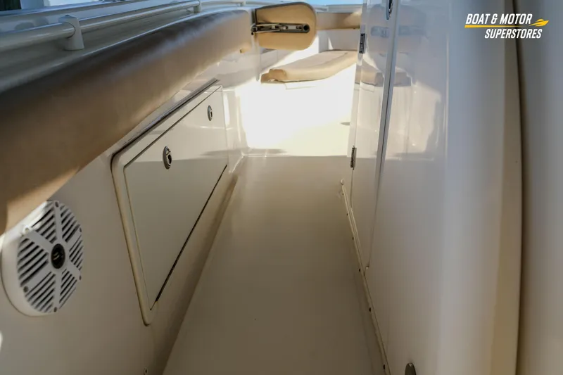 Slide: The Image of 2018 Key West Billistic 351 Center Console interior with storage and seating. - 138