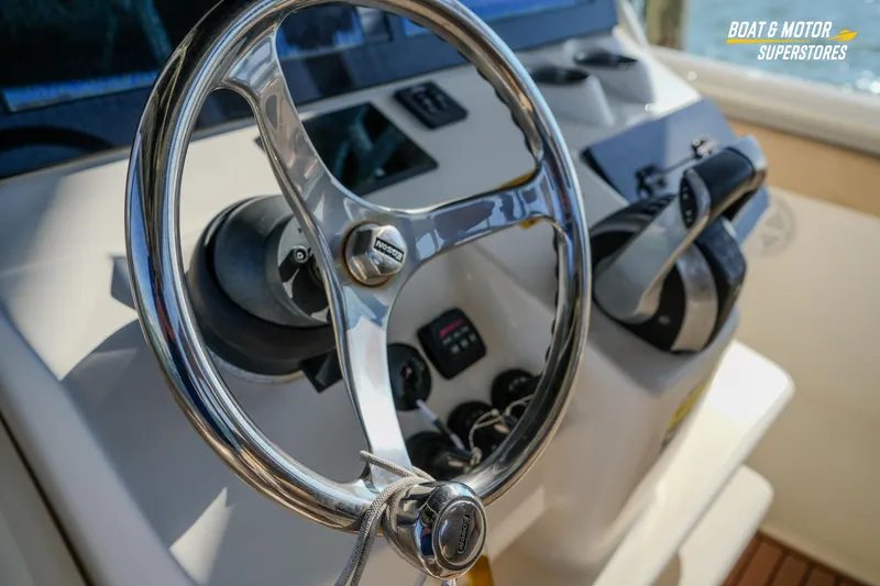 Slide: The Image of Steering wheel of 2018 Key West Billistic 351 Center Console boat, close-up view. - 139