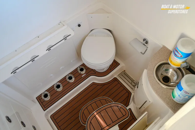 Slide: The Image of 2018 Key West Billistic 351 Center Console boat bathroom with toilet and sink. - 143