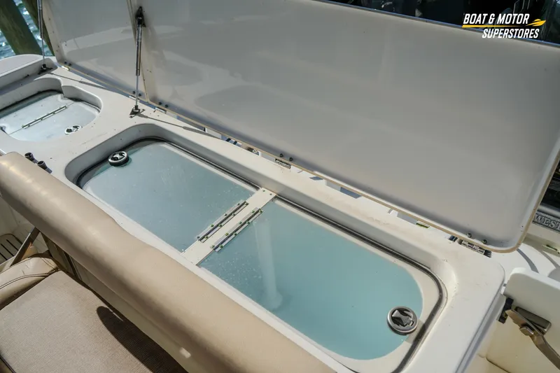 Slide: The Image of 2018 Key West Billistic 351 Center Console livewell and storage compartments. - 147