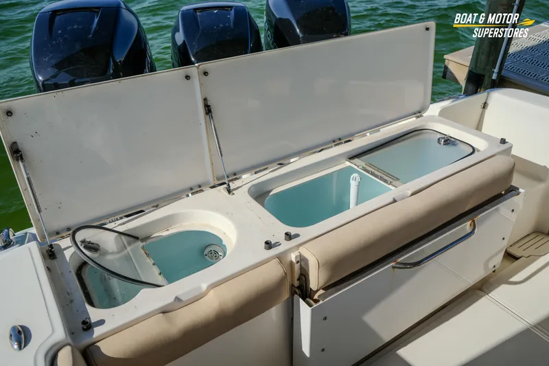 Slide: The Image of 2018 Key West Billistic 351 Center Console with open storage compartments. - 151