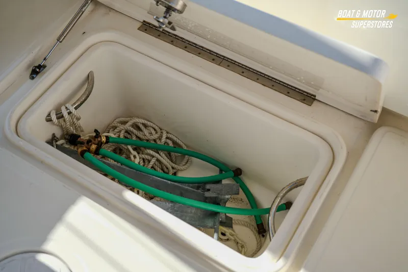 Slide: The Image of Storage compartment on 2018 Key West Billistic 351 Center Console with ropes and hoses. - 153