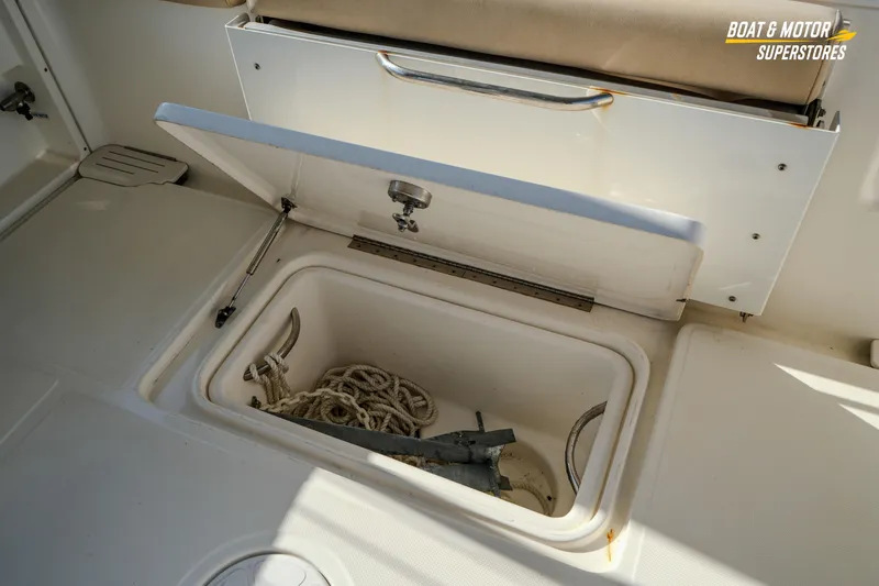 Slide: The Image of 2018 Key West Billistic 351 Center Console storage compartment with rope and anchor. - 155