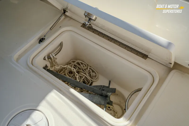 Slide: The Image of Open storage compartment on 2018 Key West Billistic 351 Center Console with anchor and rope. - 156