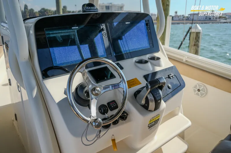 Slide: The Image of 2018 Key West Billistic 351 Center Console helm with dual displays and steering wheel. - 157