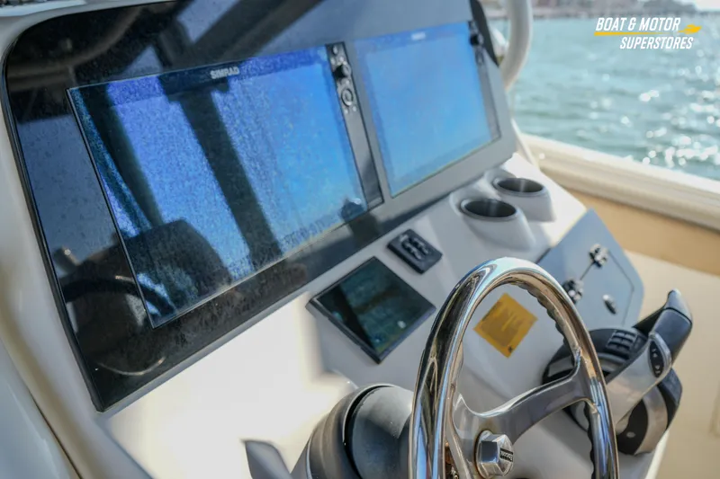 Slide: The Image of 2018 Key West Billistic 351 Center Console helm with dual displays and steering wheel. - 159