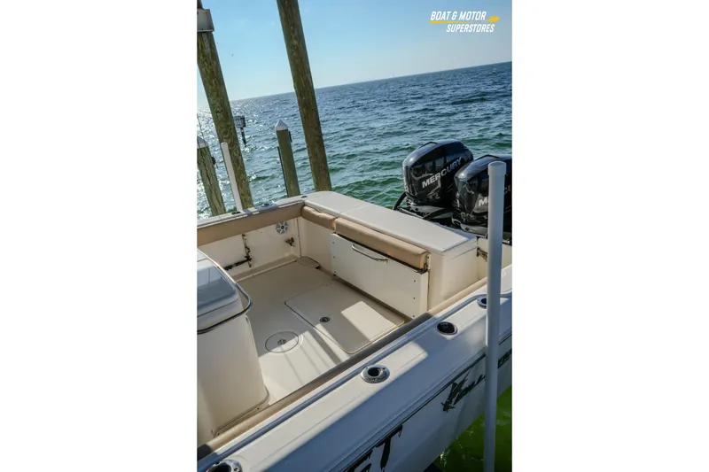 Slide: The Image of 2018 Key West Billistic 351 Center Console boat with Mercury engines, docked by the sea. - 166