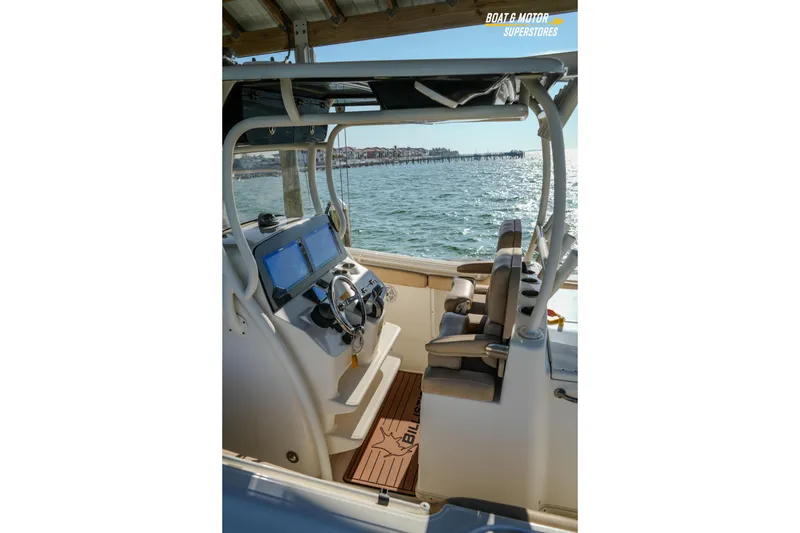 Slide: The Image of 2018 Key West Billistic 351 Center Console interior with ocean view and modern controls. - 168