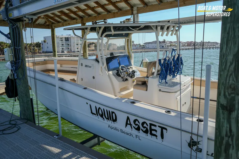 Slide: The Image of 2018 Key West Billistic 351 Center Console boat docked, labeled "Liquid Asset," in Apollo Beach, FL. - 177